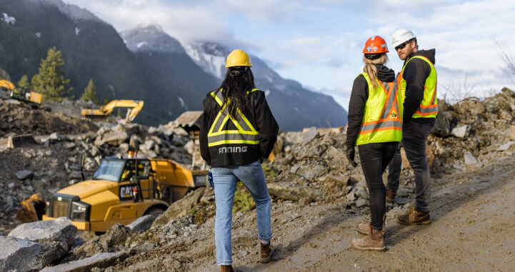 Finning and Emil Anderson representatives survey an excavation site following the 2021 BC Floods.